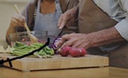 Two people chopping vegetables