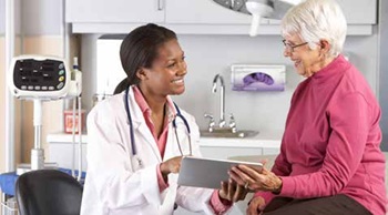 older woman with medical provider