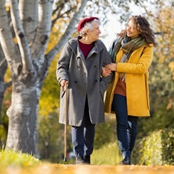 woman walking with caregiver