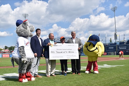 Strike out Hunger check presentation to the Worcester County Food Bank at Polar Park